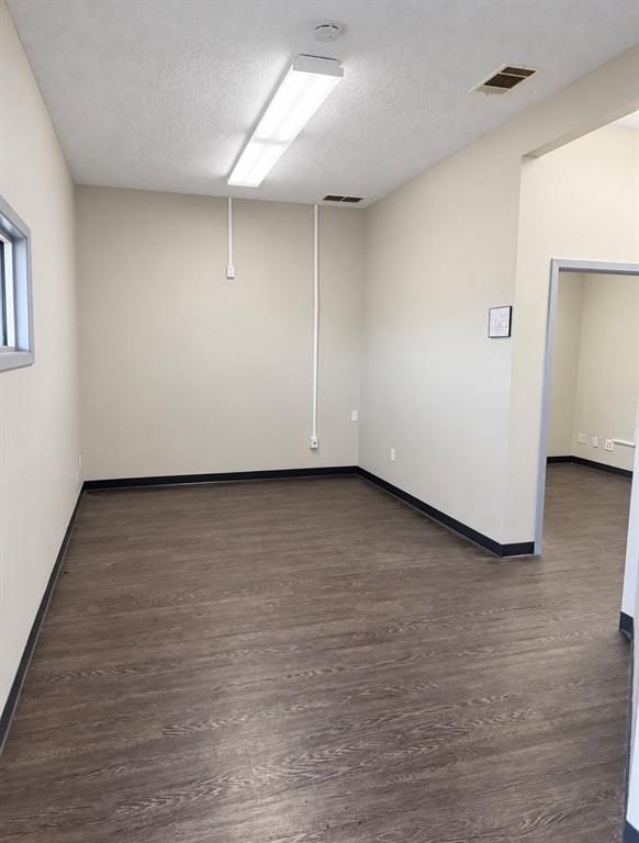 Private office with a window and an opening to the adjoining room